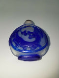 Chinese carved peking glass blue overlay dragon snuff bottle