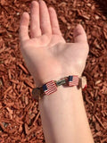 American Equality Multi Color Faces Flag Gold Tone Charm Bracelet