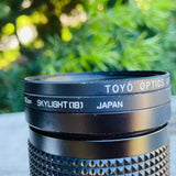 Panagor E PMC Auto 80mm f=28 1:3,5 Hoya 62 mm Toyo Skylight 1B Camera Lens Japan